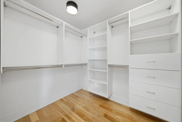 a view of an empty walk in closet