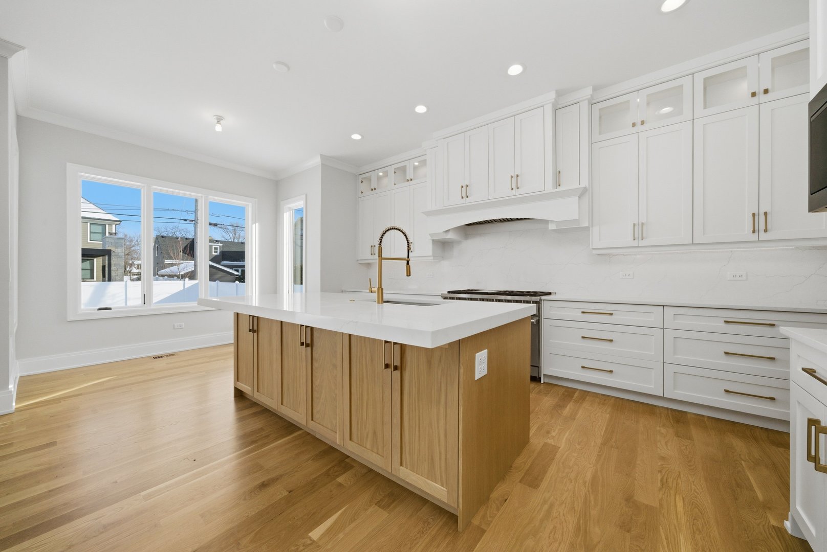 611 South Prospect Avenue Elmhurst, IL 60126 - Photo 2 of 28 a kitchen with stainless steel appliances granite countertop a sink a stove and a refrigerator