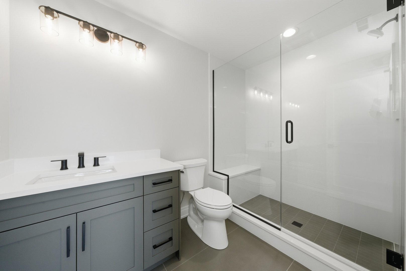611 South Prospect Avenue Elmhurst, IL 60126 - Photo 22 of 28 a bathroom with a double vanity sink toilet and shower