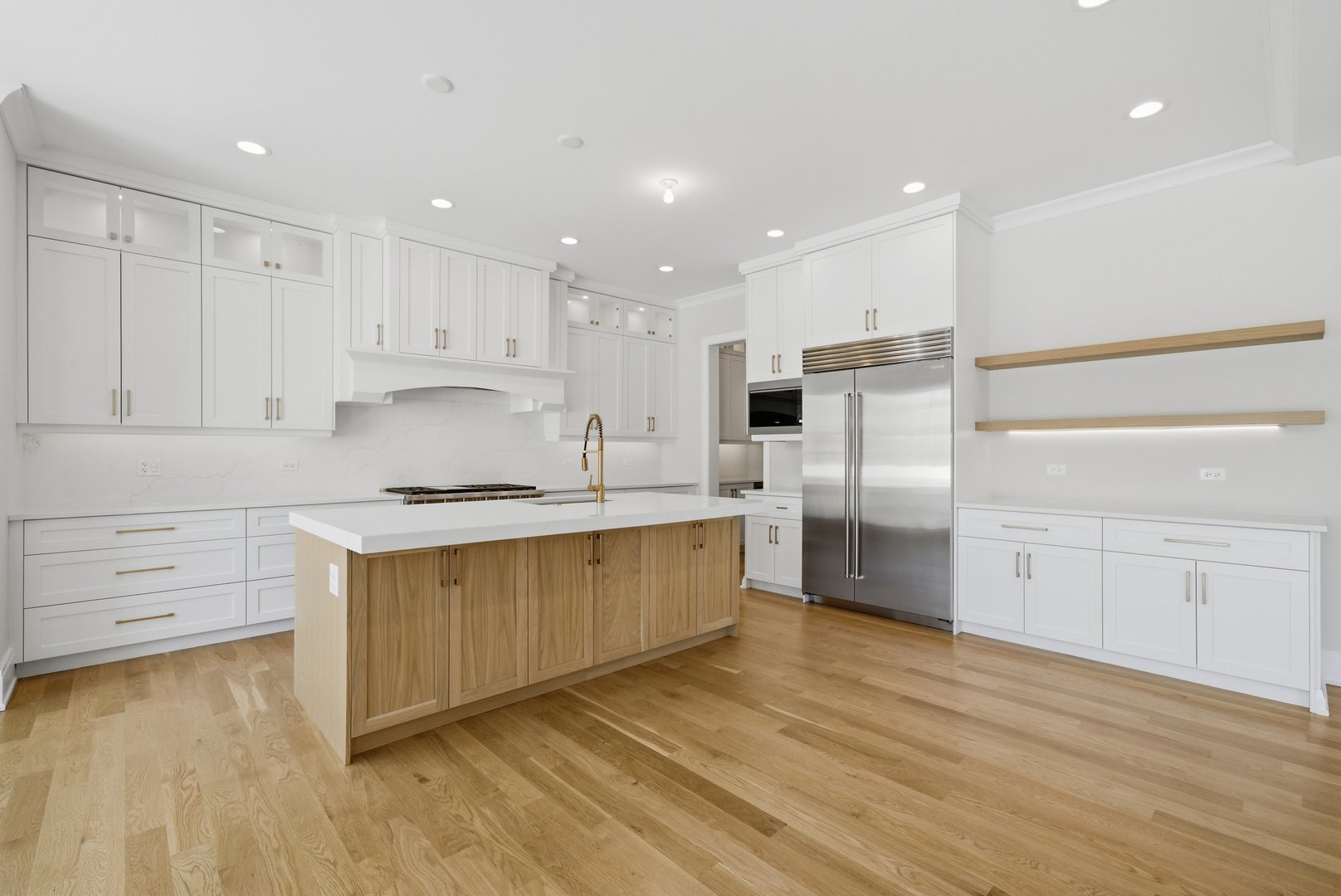 611 South Prospect Avenue Elmhurst, IL 60126 - Photo 3 of 28 a large kitchen with cabinets wooden floor and stainless steel appliances