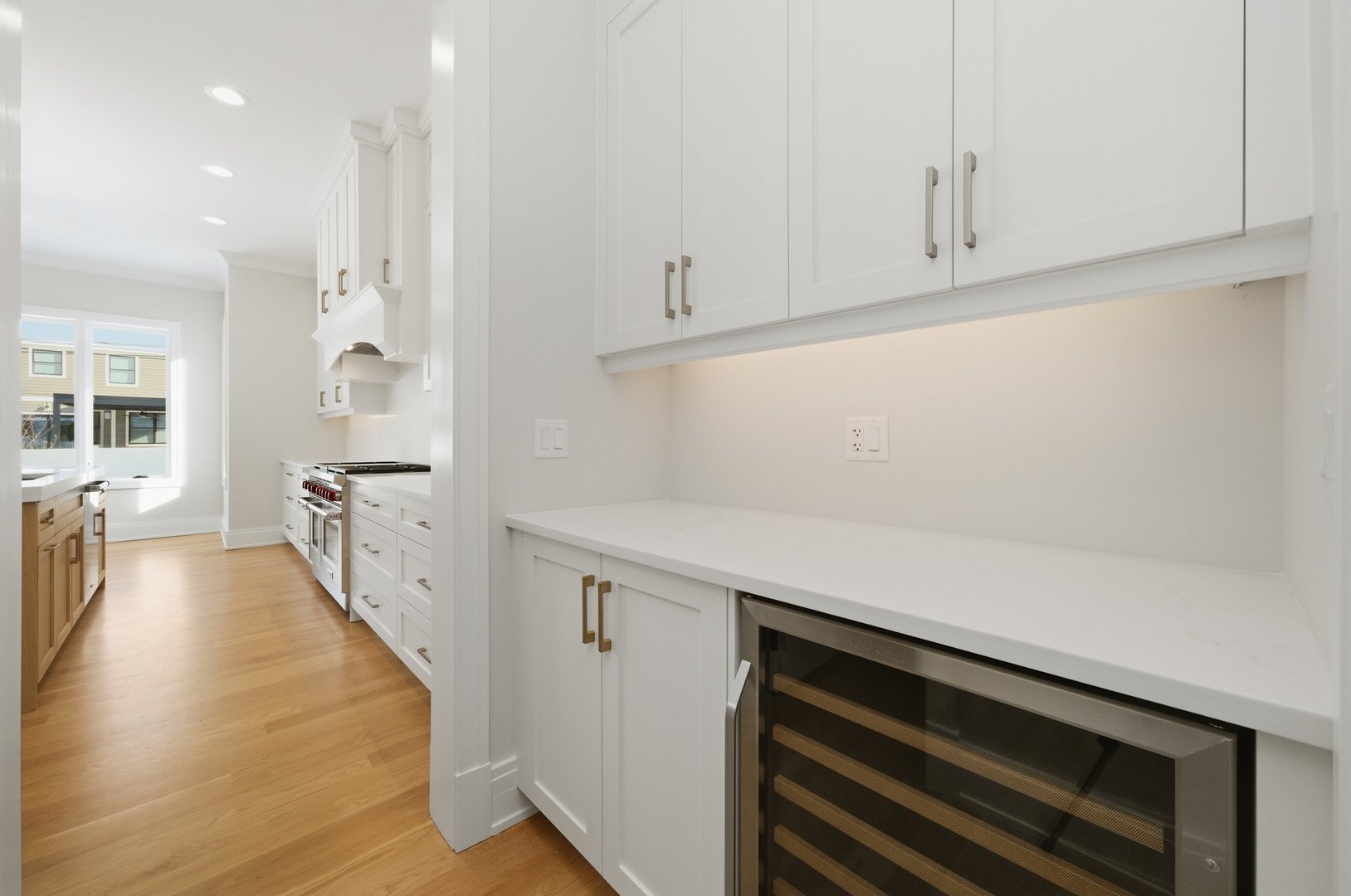 611 South Prospect Avenue Elmhurst, IL 60126 - Photo 7 of 28 a hallway with white cabinets and wooden floor