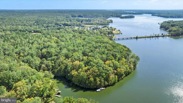 a kitchen with stainless steel appliances granite countertop a sink stove microwave and refrigerator