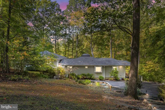 a kitchen with granite countertop cabinets stainless steel appliances and a counter space