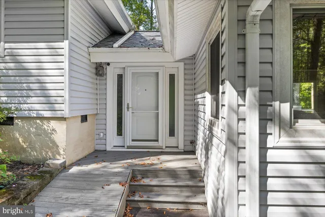 a large kitchen with wooden cabinets and sink