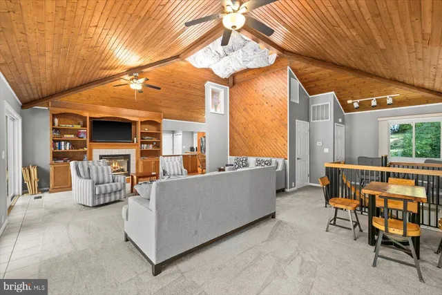 view of living room with furniture and a floor to ceiling window
