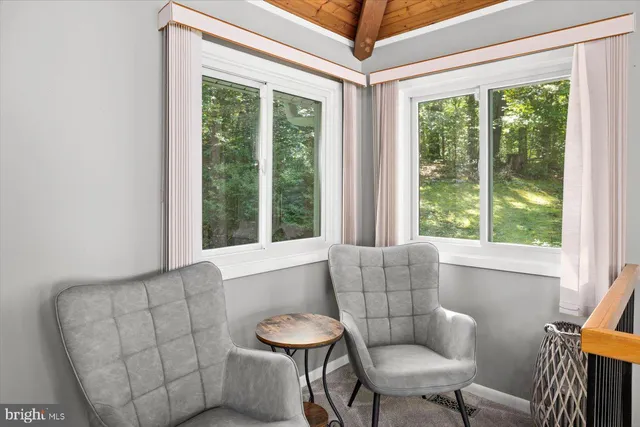 a view of a house with wooden deck front door