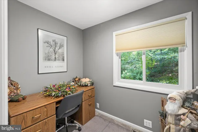an aerial view of ocean with residential house with outdoor space and river