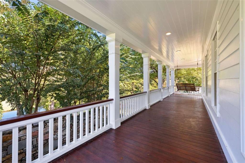 5225 Chalybeate Springs Road Woodland, GA 31836 - Photo 12 of 100 a view of a porch with wooden floor and outdoor space