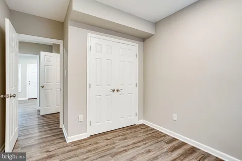 a bathroom with a sink vanity mirror and toilet