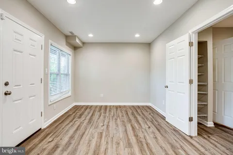 a bathroom with a sink vanity and a mirror