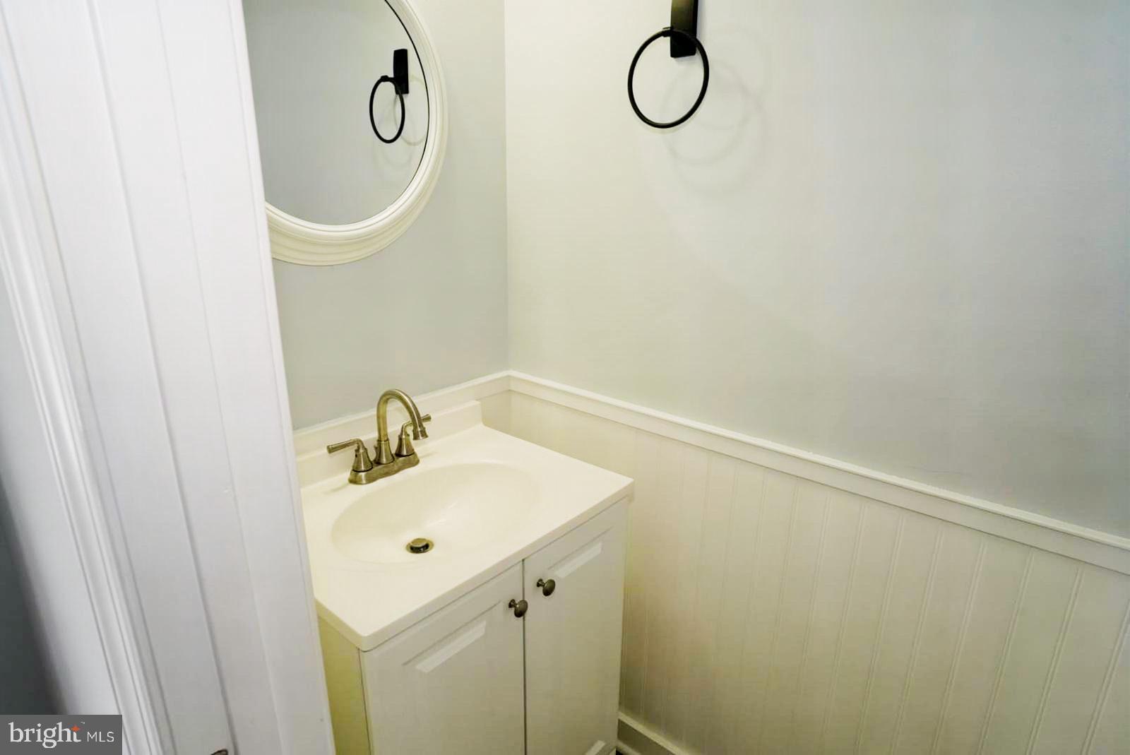 1217 Steed Street Ranson, WV 25438 - Photo 20 of 23 a bathroom with a sink a mirror and shower view