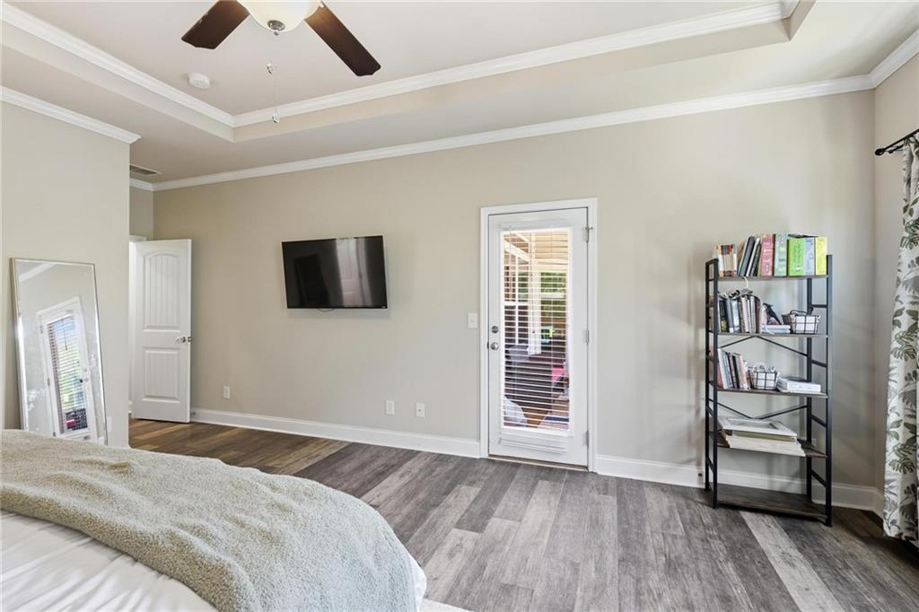 47 Violet Lane Dallas, GA 30132 - Photo 15 of 27 a bedroom with a bed and a flat screen tv
