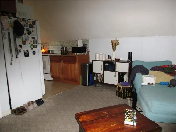 a room with furniture and a flat screen tv