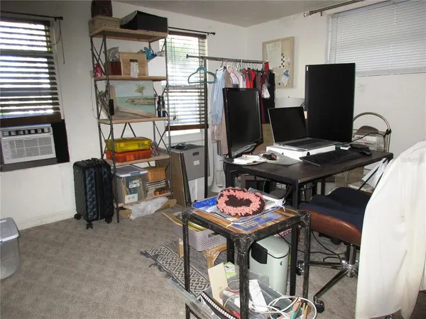 a view of a workspace with furniture