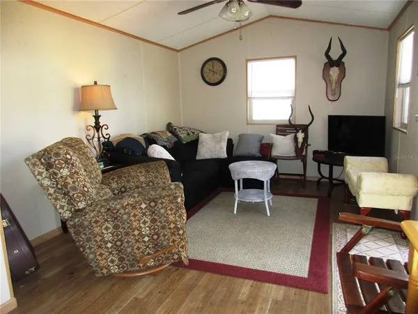 a living room with furniture a window and a fireplace