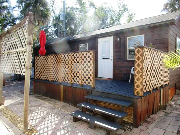 a view of outdoor space with deck and furniture