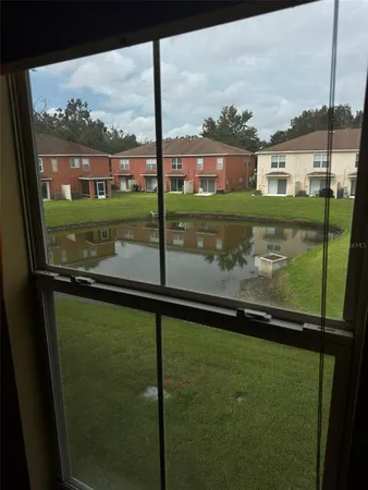 a view of swimming pool from a window