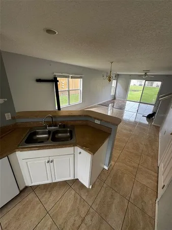 a kitchen that has a sink and a stove