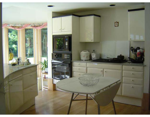 2 Regis Road Andover, MA 01810 - Photo 5 of 9 a kitchen with cabinets and appliances