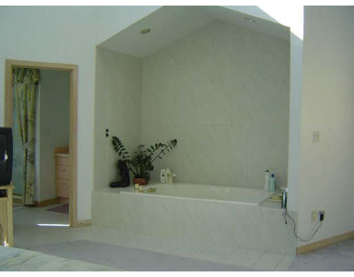 2 Regis Road Andover, MA 01810 - Photo 8 of 9 a bath tub sitting next to a bathroom