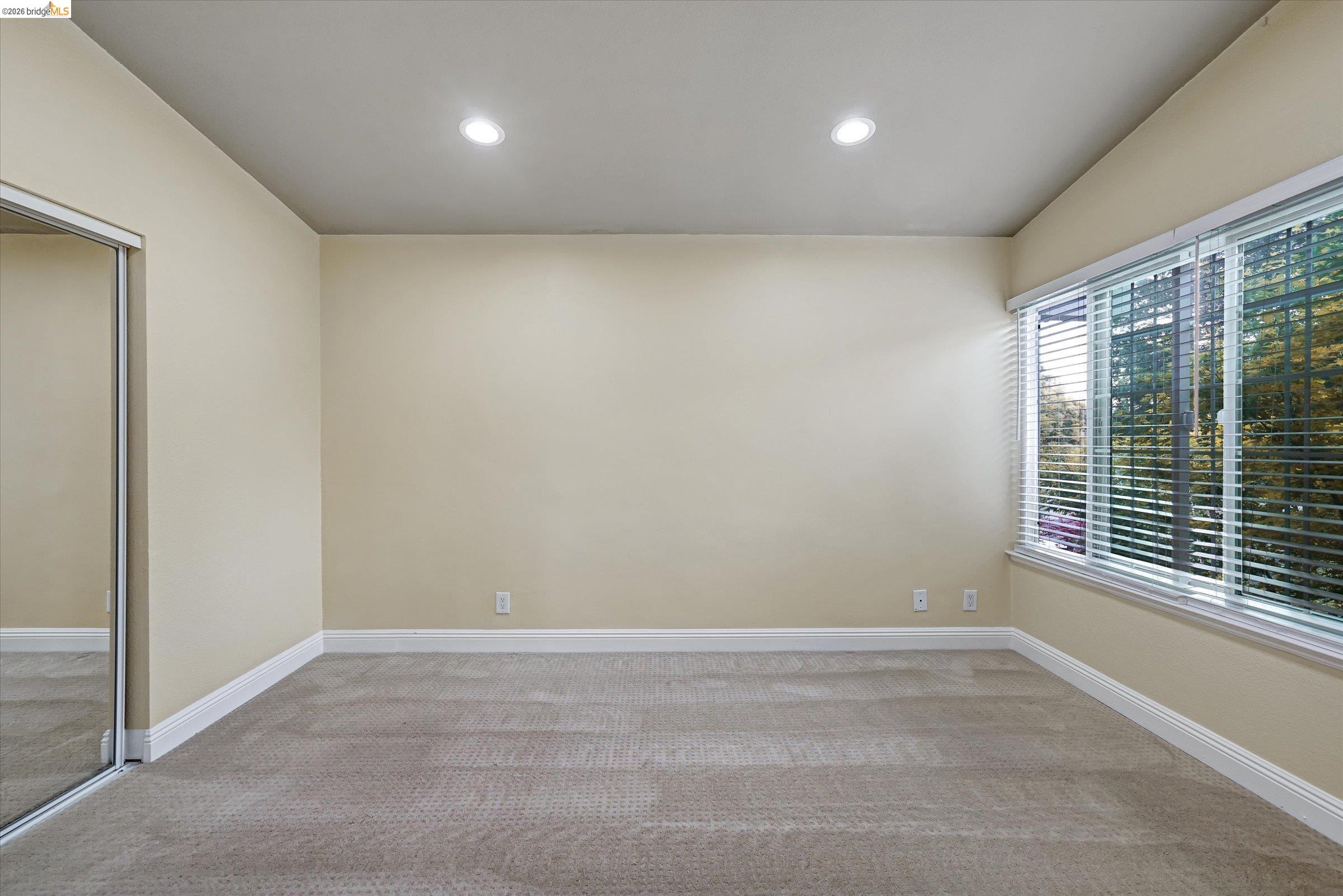 108 Castleton Court San Ramon, CA 94583 - Photo 22 of 41 Empty room with light carpet and recessed lighting