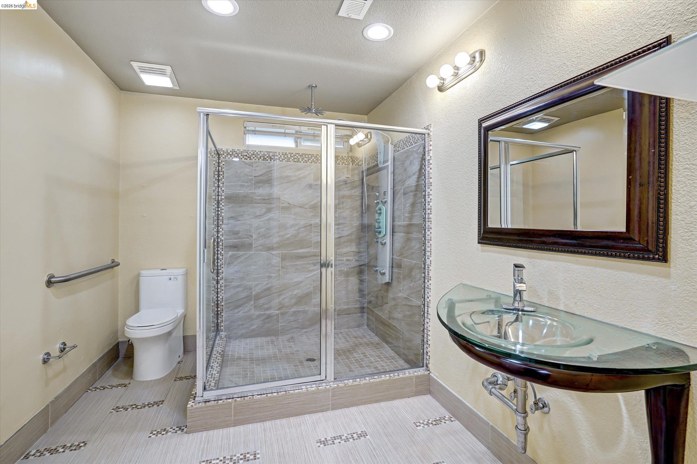 108 Castleton Court San Ramon, CA 94583 - Photo 26 of 41 Full bath with a shower stall, a textured wall, light tile patterned flooring, and recessed lighting