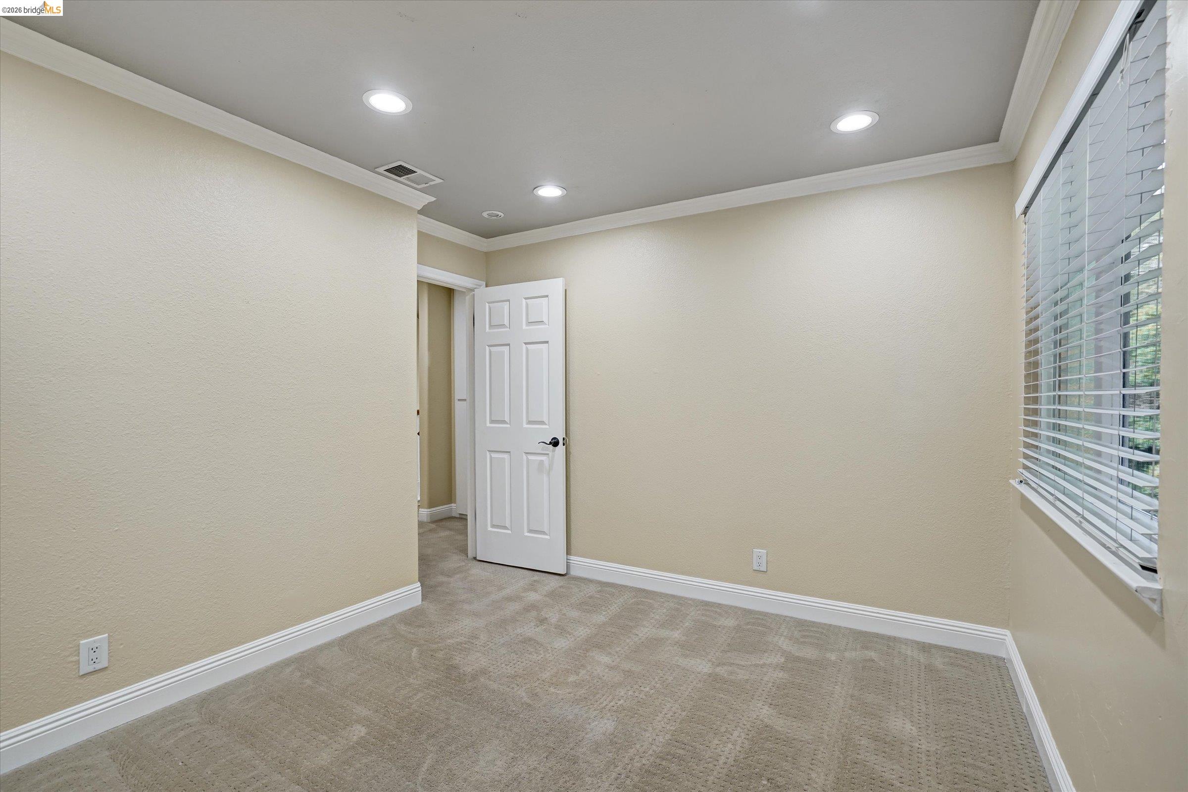 108 Castleton Court San Ramon, CA 94583 - Photo 33 of 41 Spare room with light carpet, recessed lighting, and crown molding