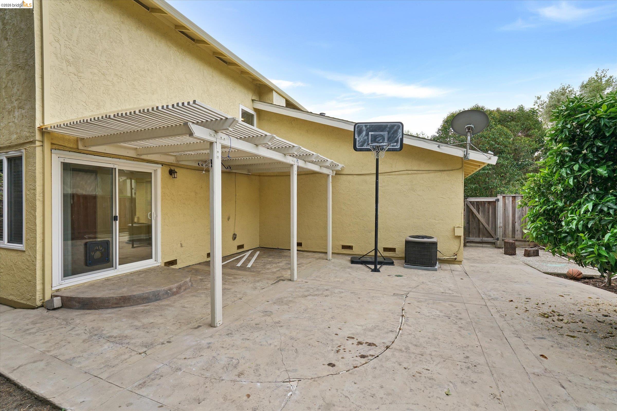 108 Castleton Court San Ramon, CA 94583 - Photo 37 of 41 Rear view of house featuring a patio, a pergola, stucco siding, and a gate