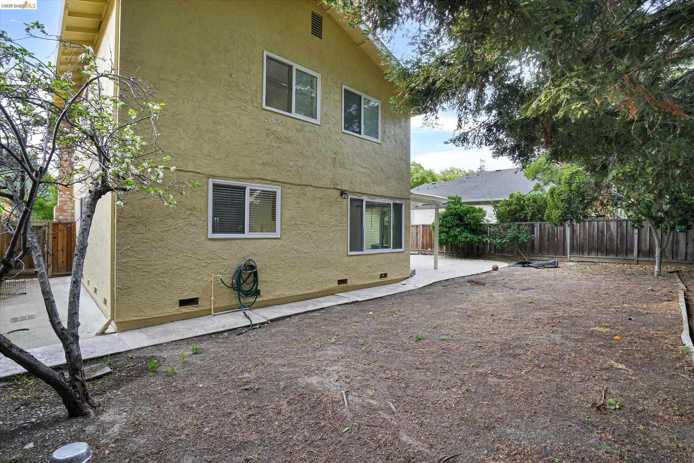 108 Castleton Court San Ramon, CA 94583 - Photo 40 of 41 Back of house with crawl space, stucco siding, a fenced backyard, and a patio