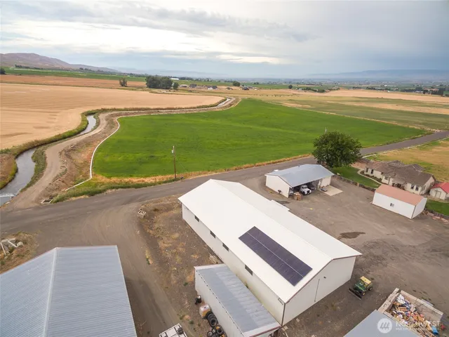 an aerial view of a house with a ocean view