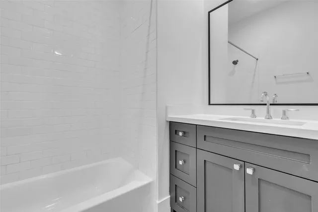 a bathroom with a sink and a bathtub