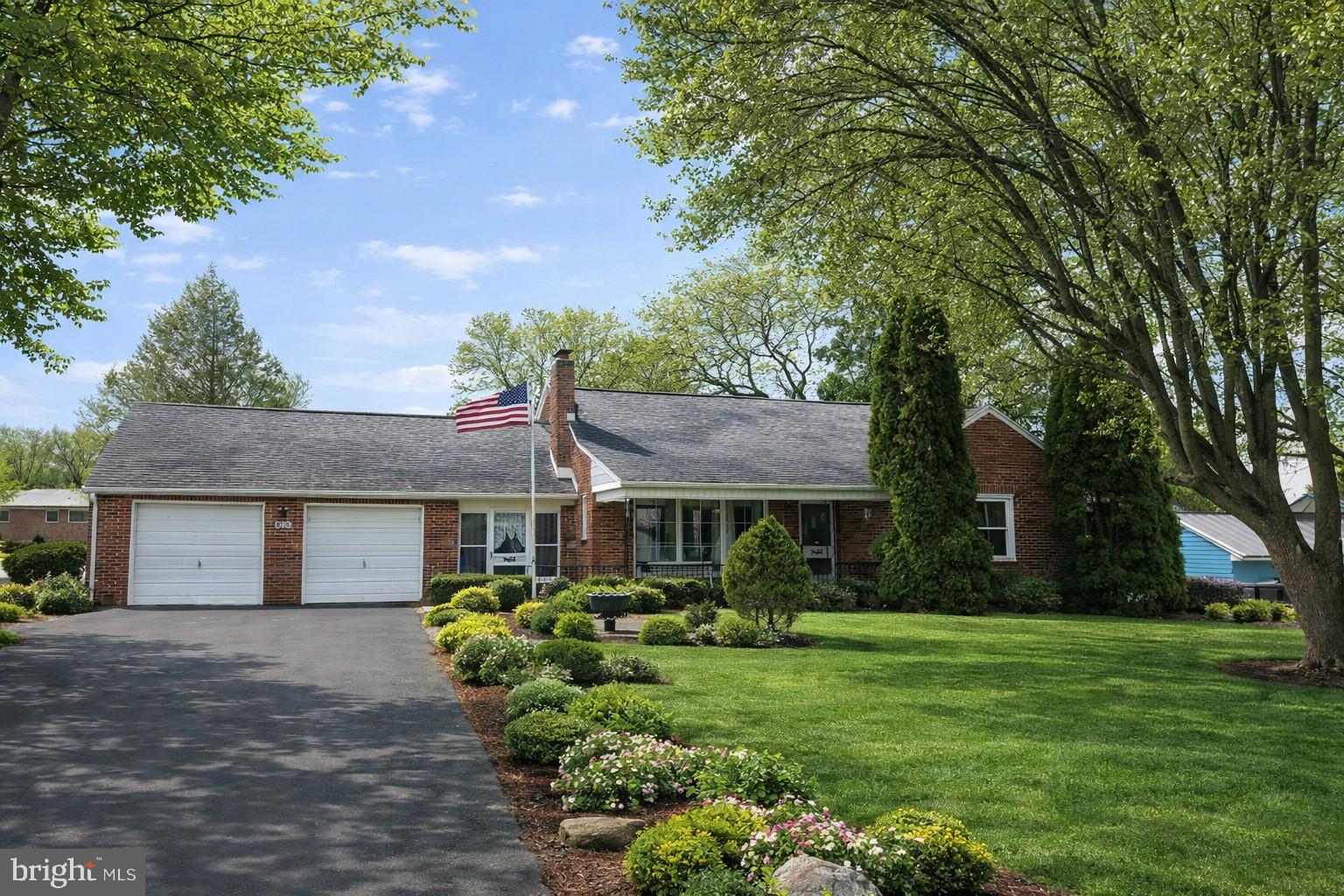 3570 Carlisle Road Dover, PA 17315 - Photo 1 of 49 a front view of a house with a garden