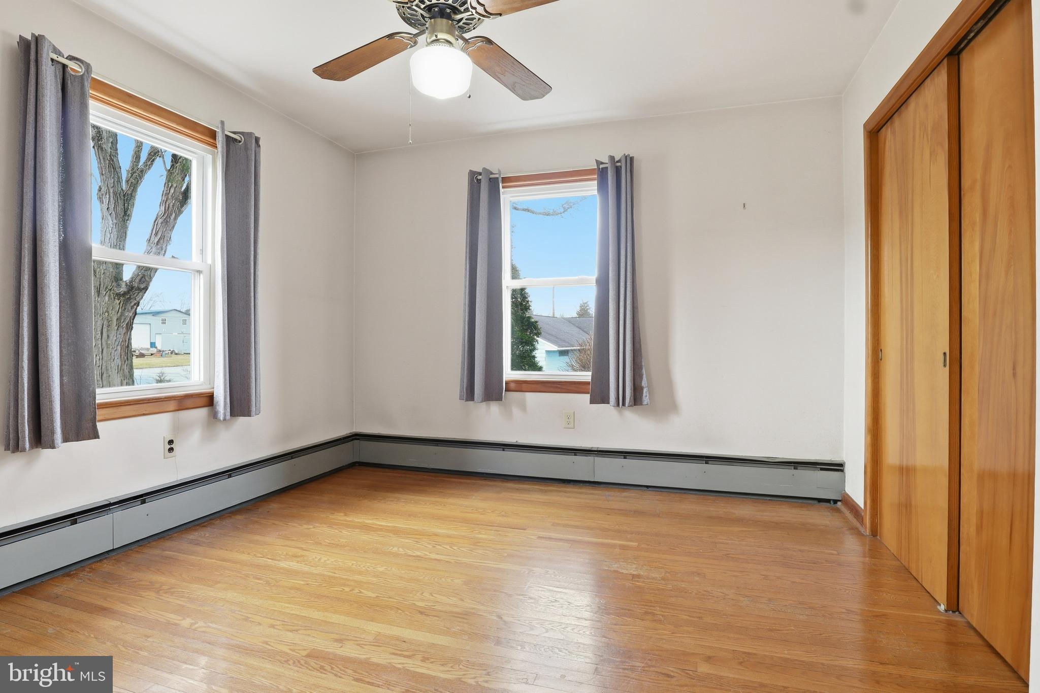 3570 Carlisle Road Dover, PA 17315 - Photo 17 of 49 a view of an empty room with a window and wooden floor