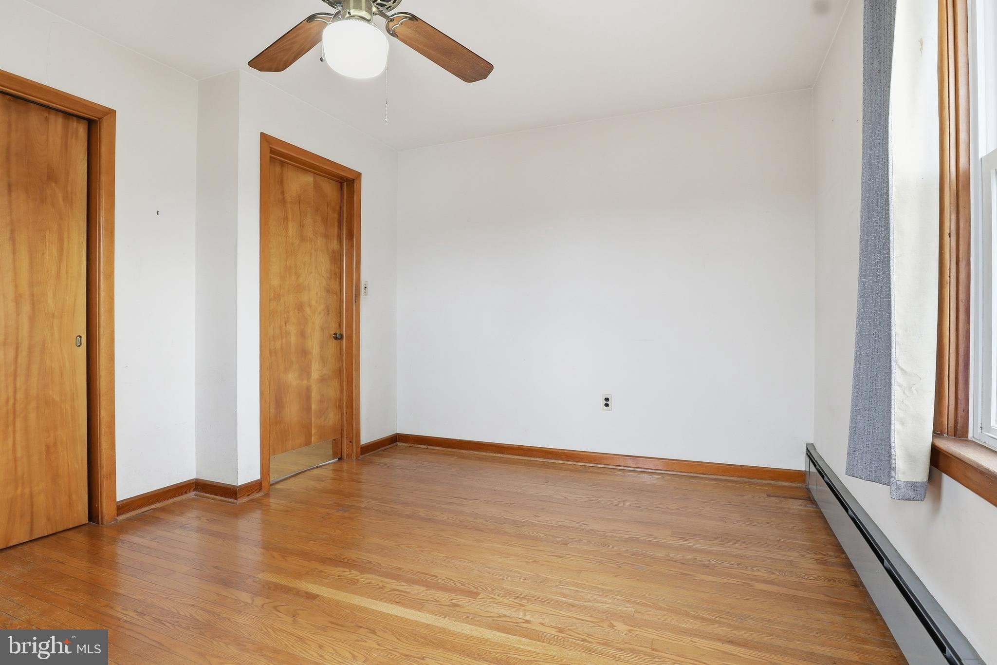 3570 Carlisle Road Dover, PA 17315 - Photo 18 of 49 a view of an empty room with wooden floor and a window