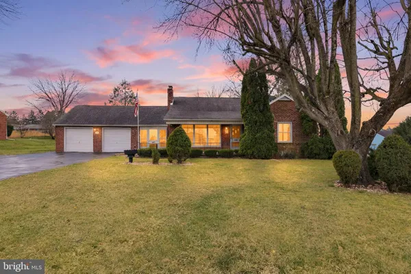 a house view with swimming pool in front of house