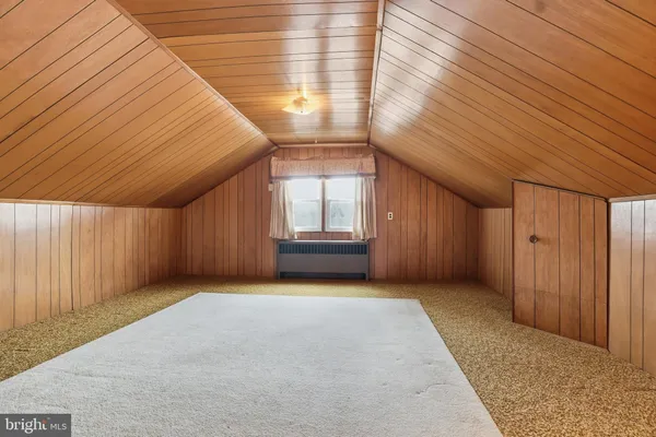 a view of a big room with wooden walls