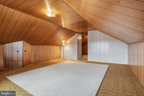 a view of a room with wooden furniture