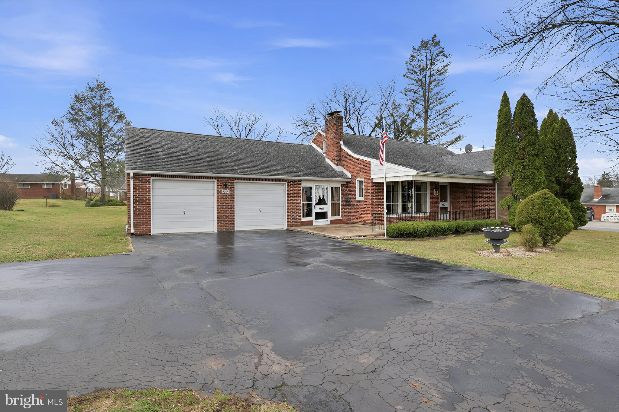 3570 Carlisle Road Dover, PA 17315 - Photo 4 of 49 a front view of a house with a yard and garage