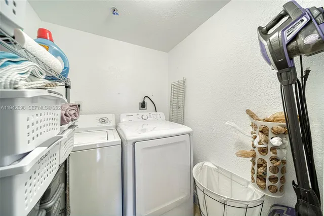 a utility room with dryer and washer