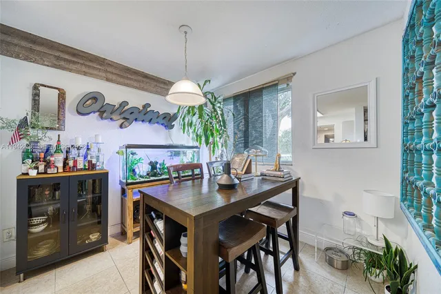 a view of a dining room and a table and chairs