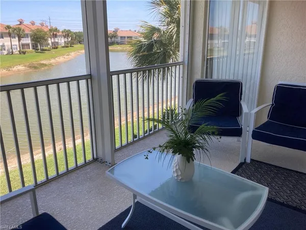 a view of a balcony with furniture