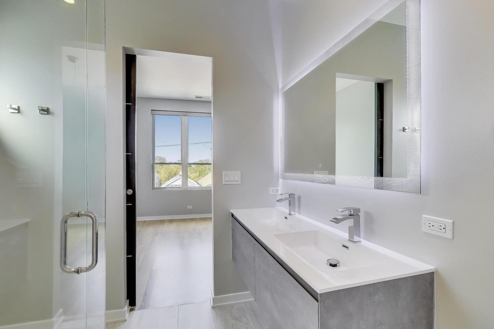 1708 West Cermak Road, Unit 3W Chicago, IL 60608 - Photo 14 of 26 a bathroom with a sink and mirror