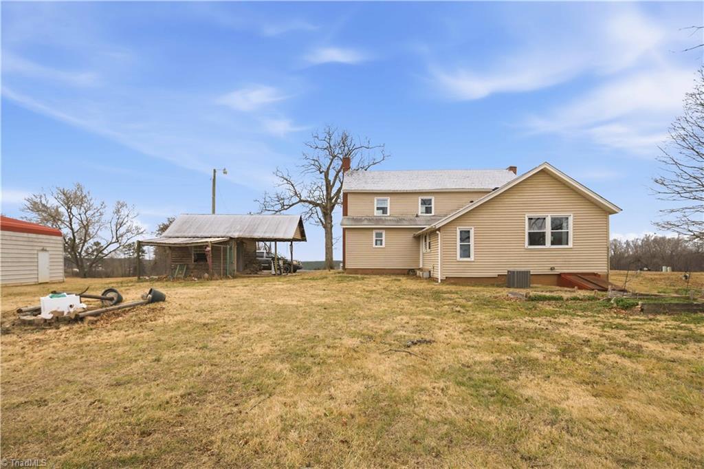1149 Quaker Church Road Siloam, NC 27047 - Photo 19 of 47 Back of home and back yard