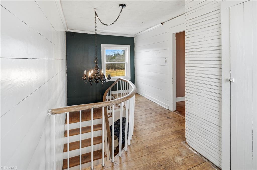 1149 Quaker Church Road Siloam, NC 27047 - Photo 42 of 47 Upstairs hallway and stairs