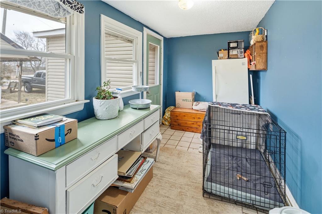 1149 Quaker Church Road Siloam, NC 27047 - Photo 45 of 47 Enclosed back porch