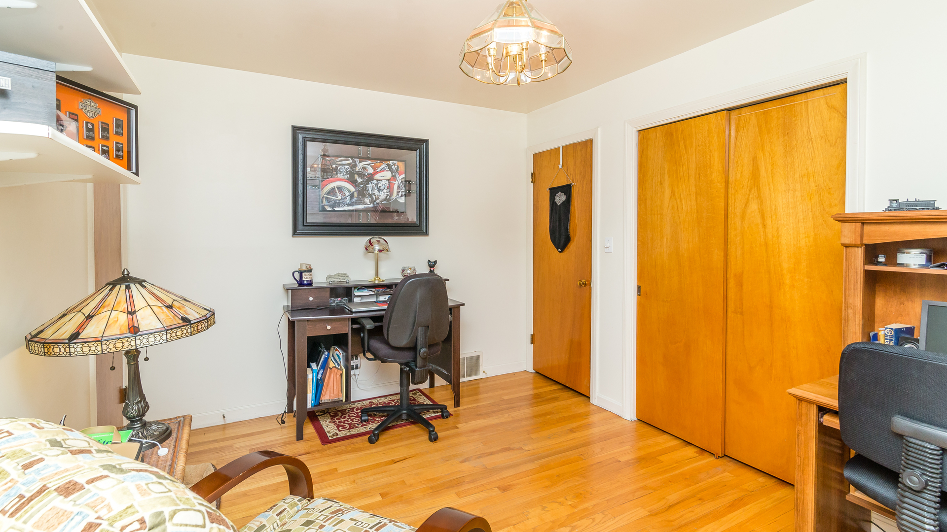 718 Spring Road Elmhurst, IL 60126 - Photo 22 of 34 a view of a workspace with furniture and a window