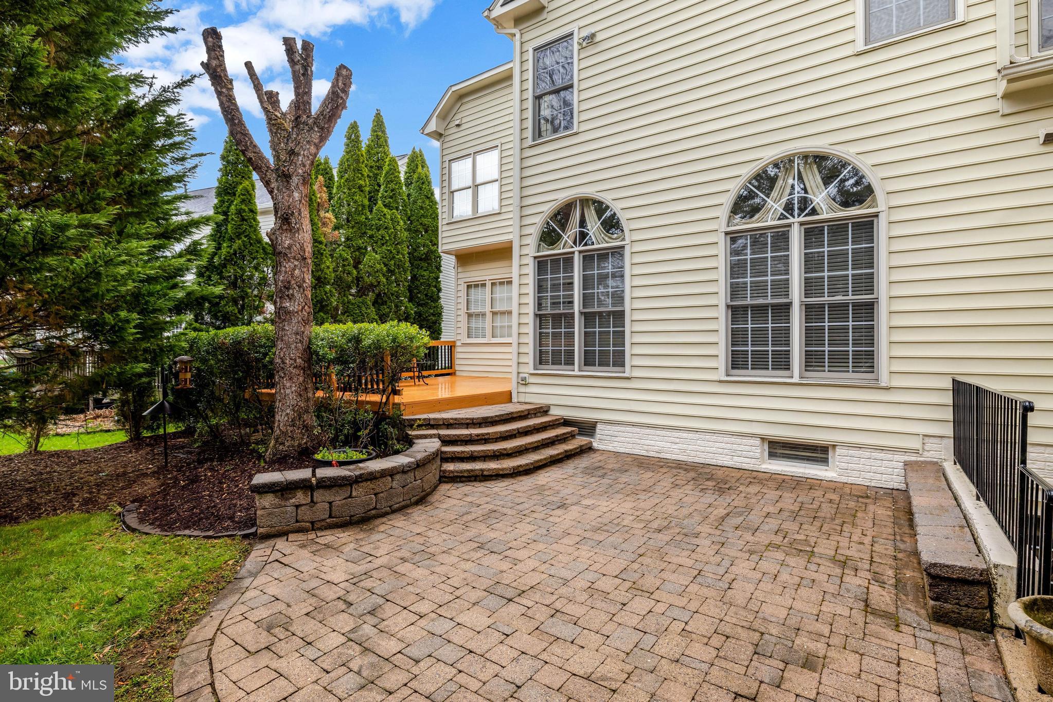 20443 Cliftons Point Street Sterling, VA 20165 - Photo 35 of 37 a backyard of a house with yard and outdoor seating