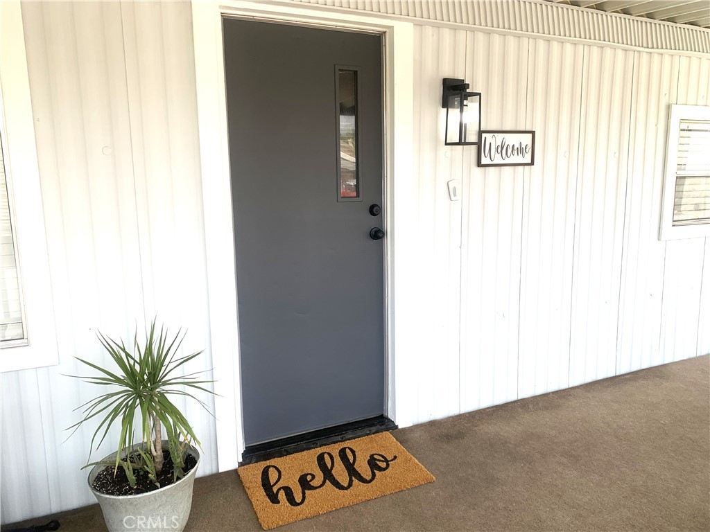 975 California Street, Unit 72 Calimesa, CA 92320 - Photo 6 of 23 a view of an entryway with wooden floor