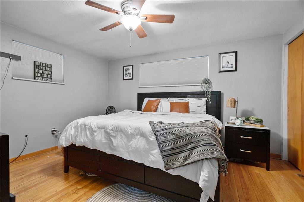 314 Rockfield Road Pittsburgh, PA 15243 - Photo 14 of 21 a bedroom with a bed and wooden floor