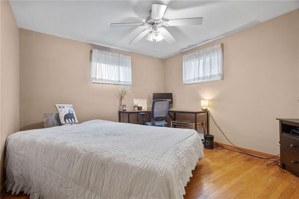 314 Rockfield Road Pittsburgh, PA 15243 - Photo 15 of 21 a bedroom with a bed a table and chair